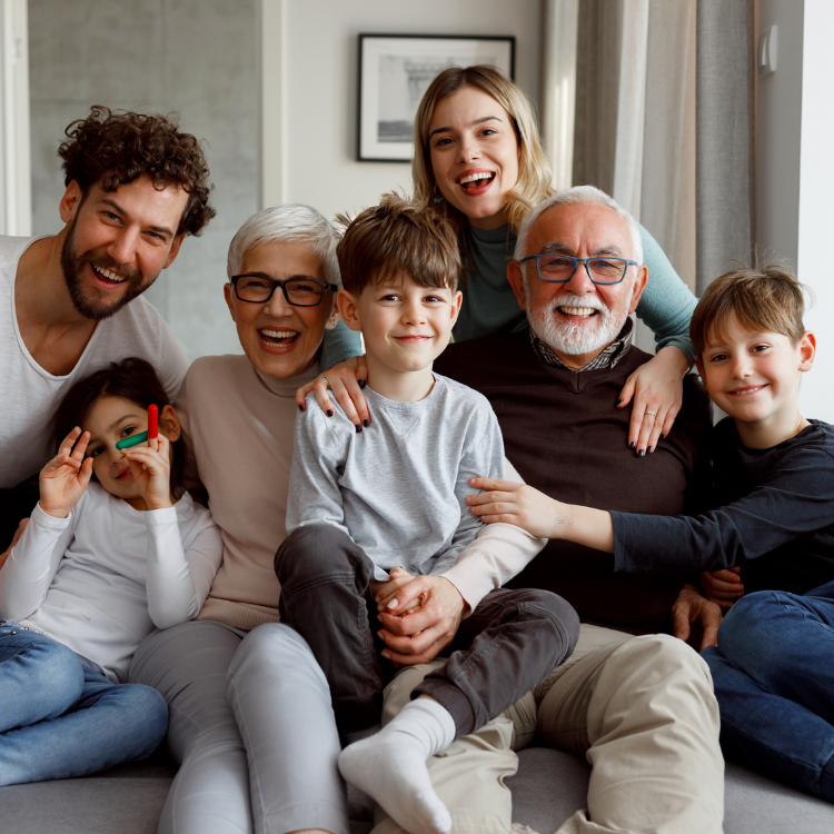 BCM Family Unity & Support Three-generation family smiling together at home, showing warmth, support, and togetherness—representing BestCareMatch™ family care guidance, senior placement support, and healthcare coverage assistance.